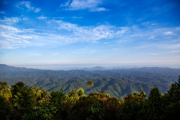 Mountains view landscape in rain forest with blue sky. Beautiful scenery view in countryside of asia.