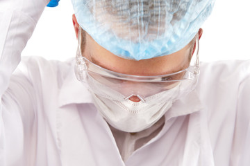 Pharmacist with single cure pill in hand