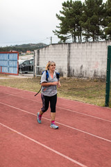 Fototapeta premium young woman running on track