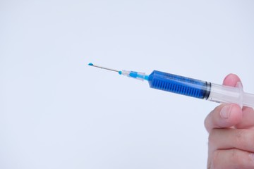 Medical syringe isolated and syringes with colored liquid on white background  