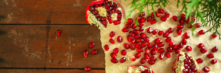 pomegranate fruit red and branches green  (vitamin dessert) good New Year spirit. top food background. copy space