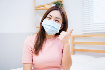 Woman suffer from cough with face mask protection.