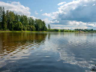 Obraz na płótnie Canvas Picture of a beautiful lake and clouds, summer sunny day with reflections, Latvia