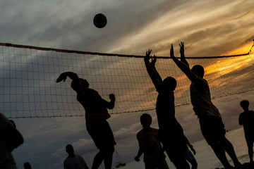 Beach volleyball under sunset - 2