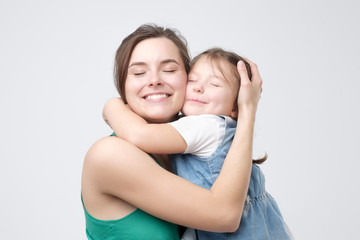 Woman hugging her cute child baby girl. Mother Day love family, parenthood childhood concept