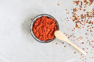 Traditional Maghrebi hot chili pepper sauce paste harissa. Marocco and arabic cuisine. Georgian adjika. Italian peperoncino sause