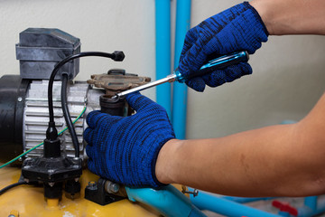 worker engineer maintenance repair gasget value of water pump