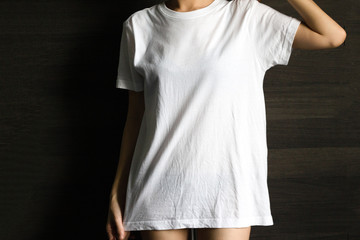 White T-shirt mockup with asian girl fashion portrait - shirt mockup model copy space dark back ground