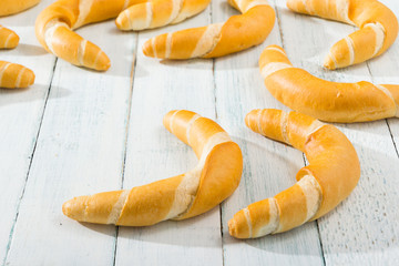 crescent rolls on white wooden table
