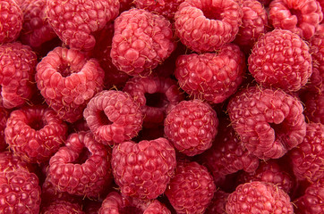 Delicious fresh and sweet red raspberries as food background. Healthy food organic nutrition. The view from the top.