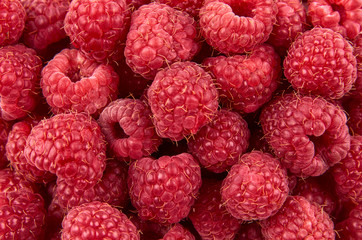 Delicious fresh and sweet red raspberries as food background. Healthy food organic nutrition. The view from the top.
