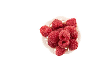 Red raspberry berries on a saucer isolated on a white background. The view from the top.