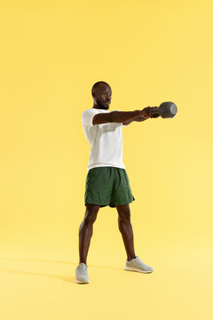 Workout. Man Doing Kettlebell Swing Exercise, Sports Training