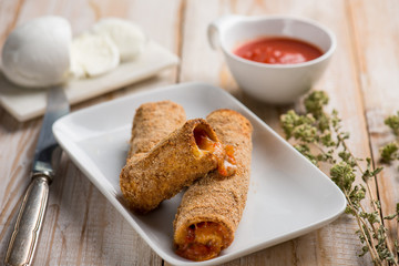 breaded ragout cannelloni with tomato sauce mozzarella and oregano