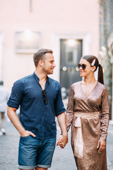 Happy couple at sunset in Italy. Evening summer photo shoot in Rome.