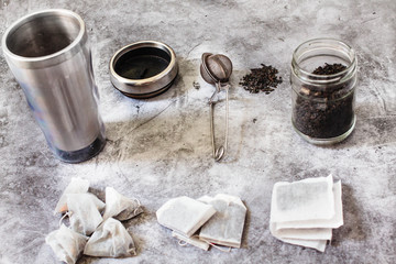 Pyramid and rectangle shaped tea bag mock up set on gray  background.  Or great black tea loose leaf. Eco-friendly alternatives.