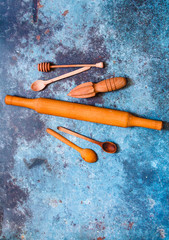 Wooden kitchen cooking utensils on blue background. Concept sustainable lifestyle or Recycling and ecology.Rustic Kitchen Decoration with wooden cutlery. Country kitchen decoration. Eco style