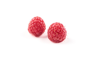 Two red raspberry Berries isolated on white background.