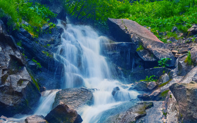 closeup rushing waterfall in a mountain
