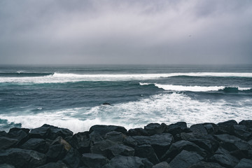 Azores, Big waves crashing over black volcanic rock on the Atlantic Ocean in the coast of Sao Miguel island in the Azores, Portugal