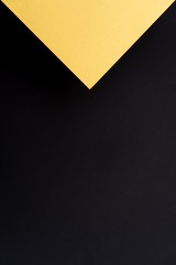 Blank black and gold geometric triangular vertical background. Layout for business, posters and banners.