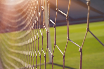 The net in Artificial turf at sunset.