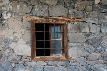 Fototapeta na wymiar old window in old stone wall