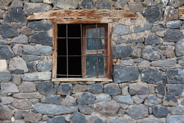 old window in old stone wall