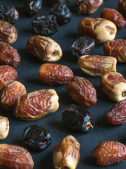 Dates are scattered on the black table