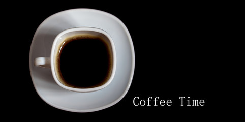 Coffee in a white cup on a dark colored background