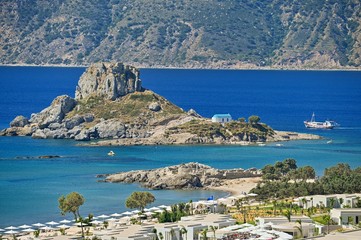 Vrachonisida Kastri - Greece island Kos. Beautiful concept for summer vacation and holiday. Beautiful landscape with sea, island and traditional small greek chapel.Natural colorful background.