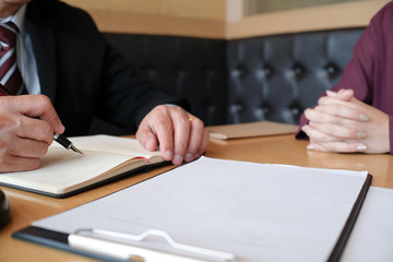 Legal counsel presents to the client a signed contract with gavel and legal law. justice and lawyer...