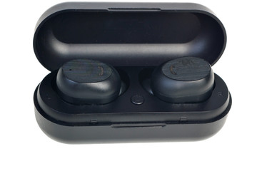 Wireless earphones.wireless headphones in the case of charging isolated on white background