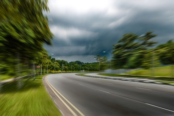 fast blur road view under heavy cloud