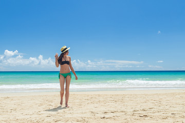 Obraz na płótnie Canvas Pretty young woman, enjoying on the beach in Fuerteventura, Canary Islands, Spain.