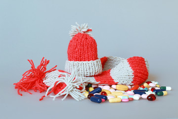  a bottle of syrup dressed in a scarf and cap in the season of colds