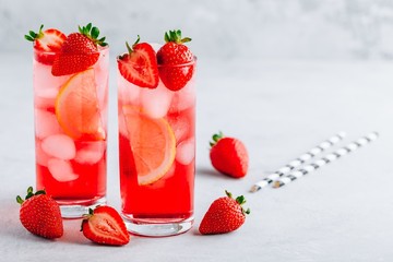 Refreshing Strawberry and lemon Iced Tea or lemonade in glasses