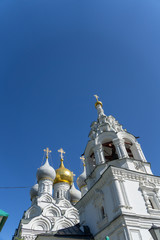 Four domes with crosses, one golden and three white, of the Orthodox Church