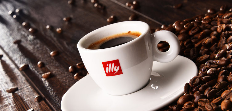 Composition with cup of Illy coffee and beans