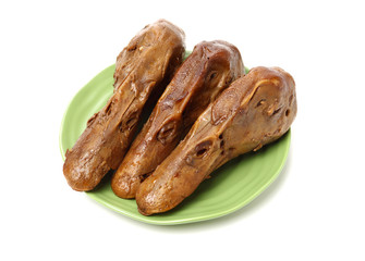 Duck head with marinated sauce on white background