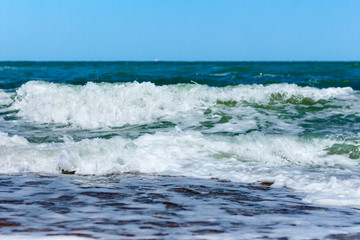 Waves on the sea in a club closeup.