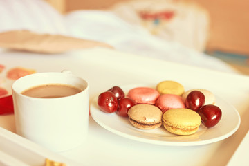 Romantic breakfast with macarons and coffee