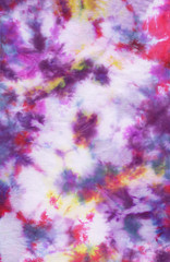 Abstract hand painted fabric background with irregular spots