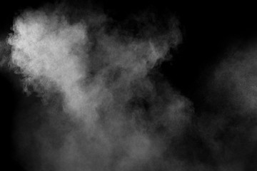 Abstract white powder explosion on a black background.Freeze motion of  white powder splash.