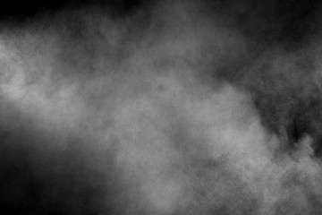 Abstract white powder explosion on a black background.Freeze motion of  white powder splash.