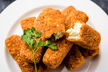Kurkuri paneer fingers or pakora/pakoda snacks also known as Crispy Cottage Cheese Bars, served with tomato ketchup as a starter. selective focus
