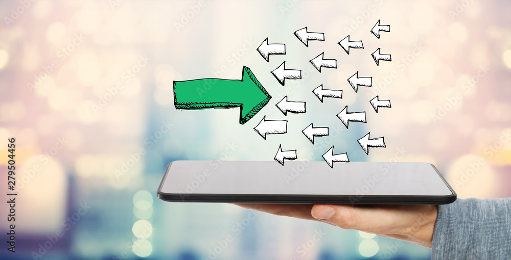 Poster arrow going in the opposite direction with man holding a tablet computer