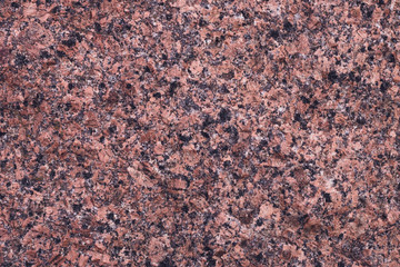 Modern marble granite slab. Orange and black texture, mineral pattern. Grunge, brown quartz wall, red rock rough surface. Abstract uneven stained uneven background.