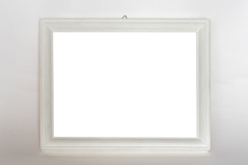 empty wooden white photo frame hanging on wall, mock-up
