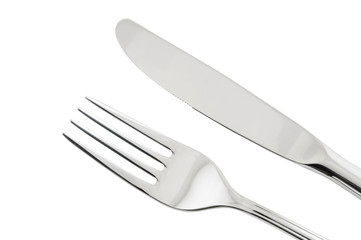 Close up of silver knife and fork isolated on white background